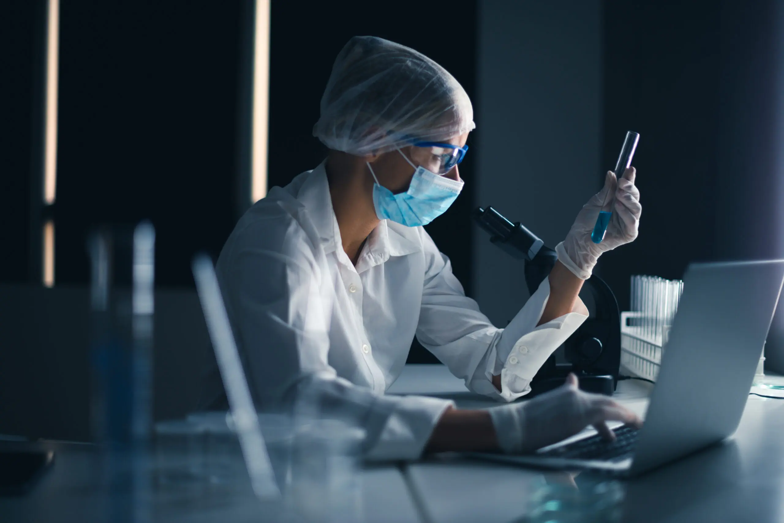 Scientist analyzing sample in a laboratory.
