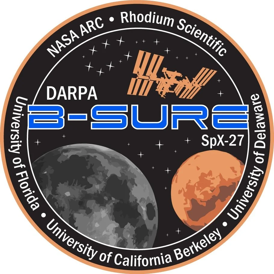 Space mission patch with planets and logos.
