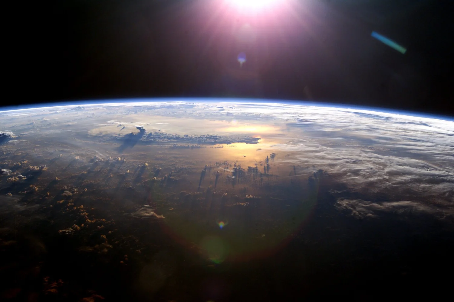 Earth's horizon from space with sunlight.