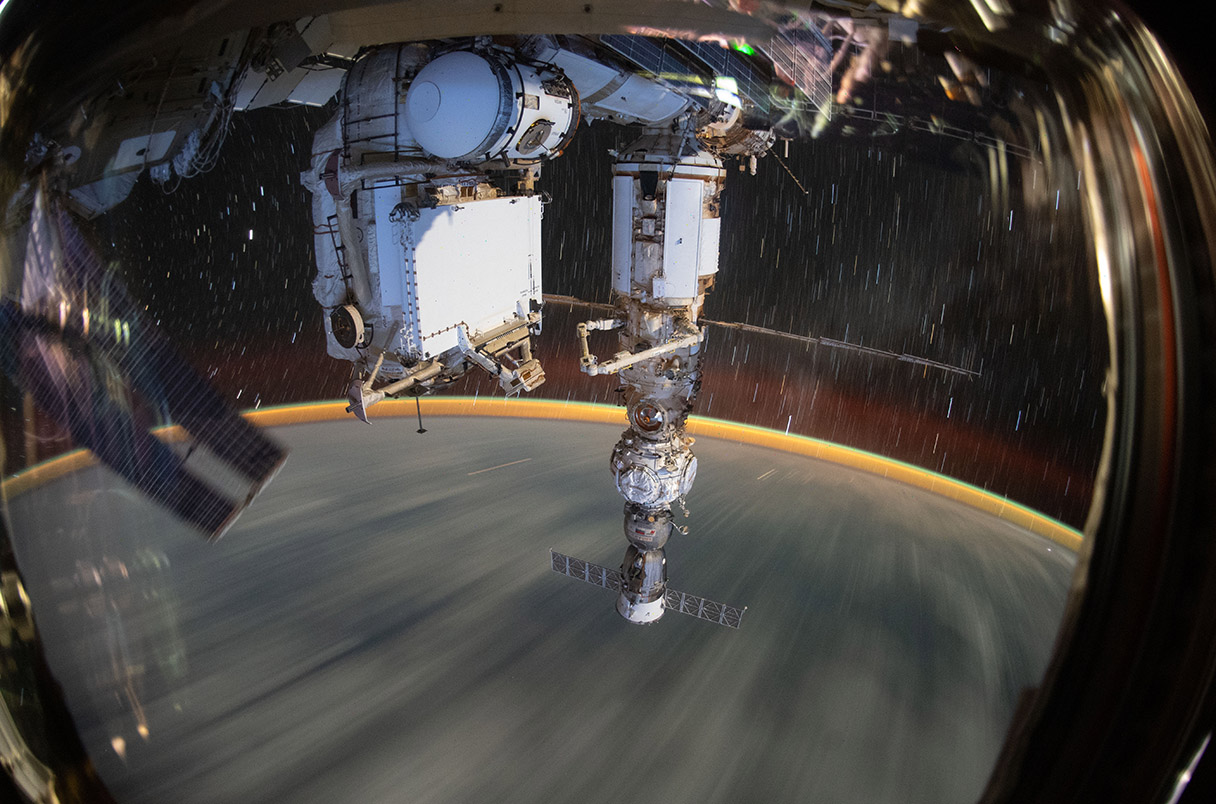 GMT267_19_52_Bob Hines_1158_Solar Array iss067e378755 (Sept. 19, 2022) --- This long-duration photograph shows the Earth 259 miles below a soaring International Space Station. In the foreground, is the Soyuz MS-21 crew ship docked to the Prichal docking module which is itself attached to the Nauka multipurpose laboratory module.