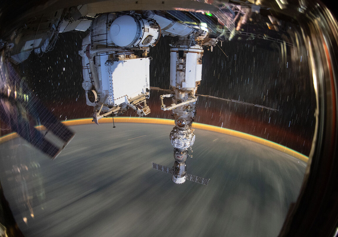 GMT267_19_52_Bob Hines_1158_Solar Array iss067e378755 (Sept. 19, 2022) --- This long-duration photograph shows the Earth 259 miles below a soaring International Space Station. In the foreground, is the Soyuz MS-21 crew ship docked to the Prichal docking module which is itself attached to the Nauka multipurpose laboratory module.