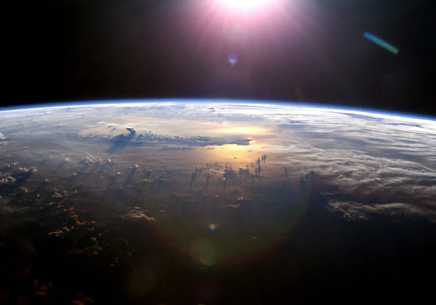 Earth's horizon from space with sunlight.